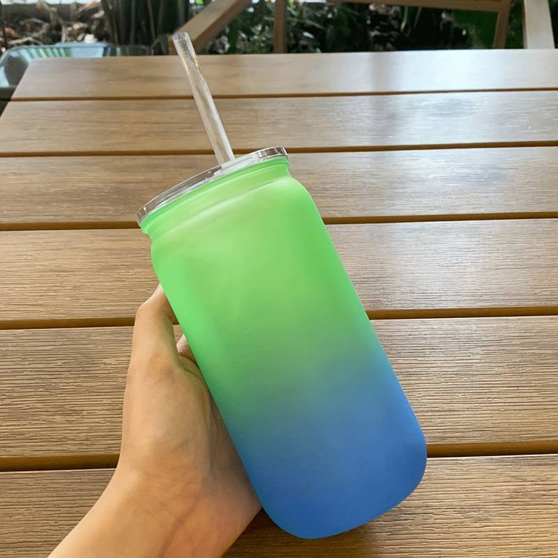 plastic drinks bottle with straw and lid