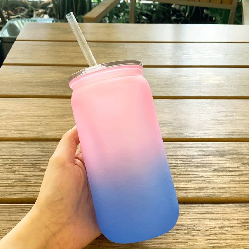 plastic drinks bottle with straw and lid